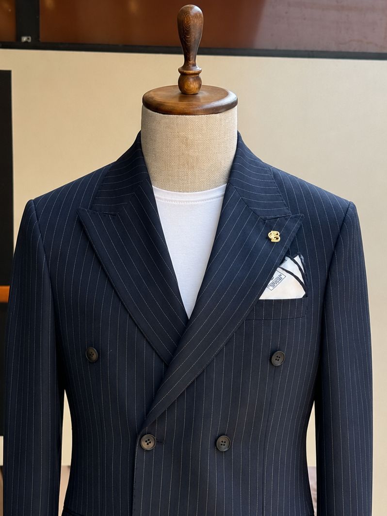 Navy striped double-breasted suit – back view displaying jacket seaming and fit