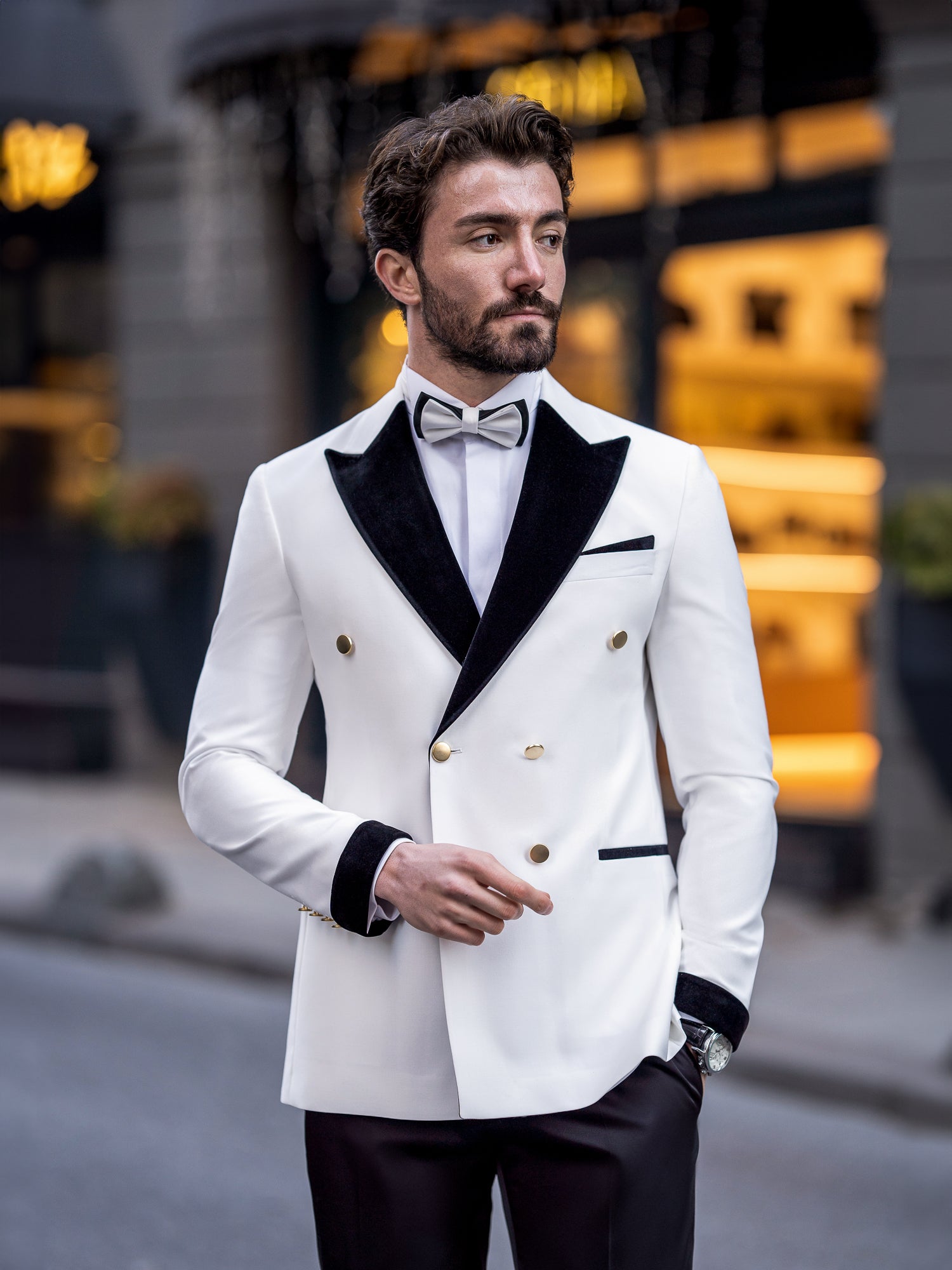 VIOSSI white double breasted tuxedo detail shot - lapel and button styling of men double breasted blazer