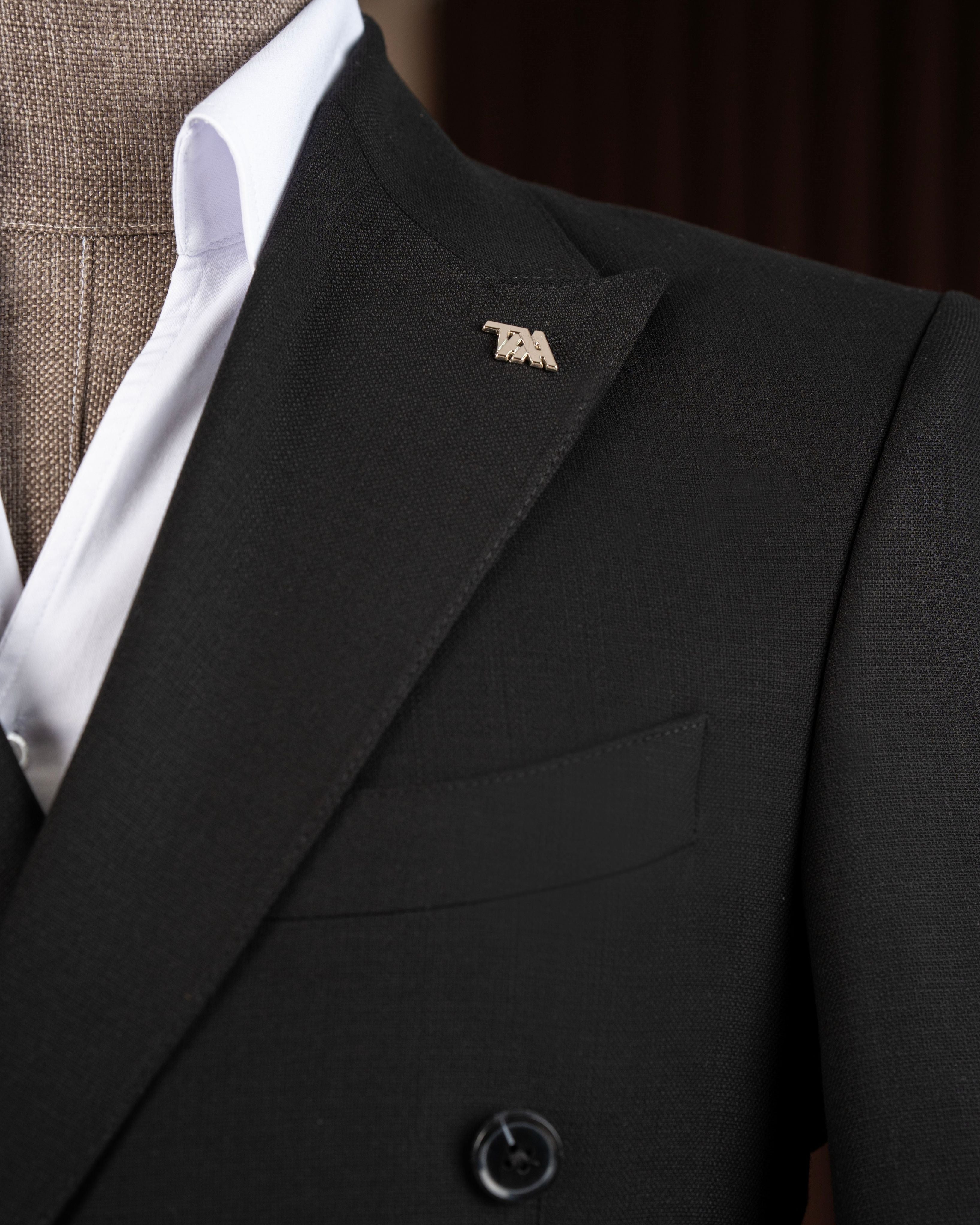Black double-breasted suit – close-up of button placement and lapel construction detail