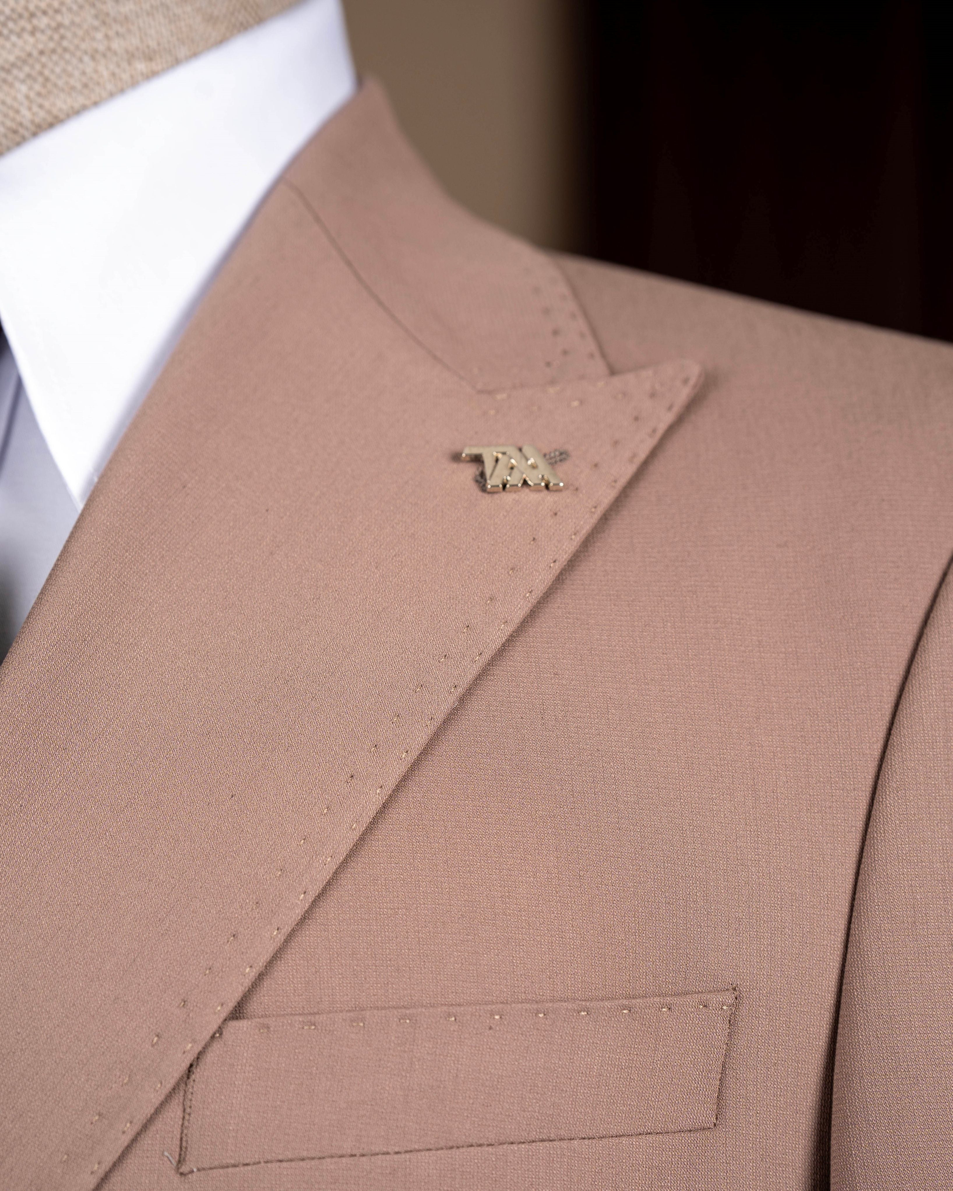 Camel double-breasted suit – two-piece displaying jacket structure and trouser line, side view