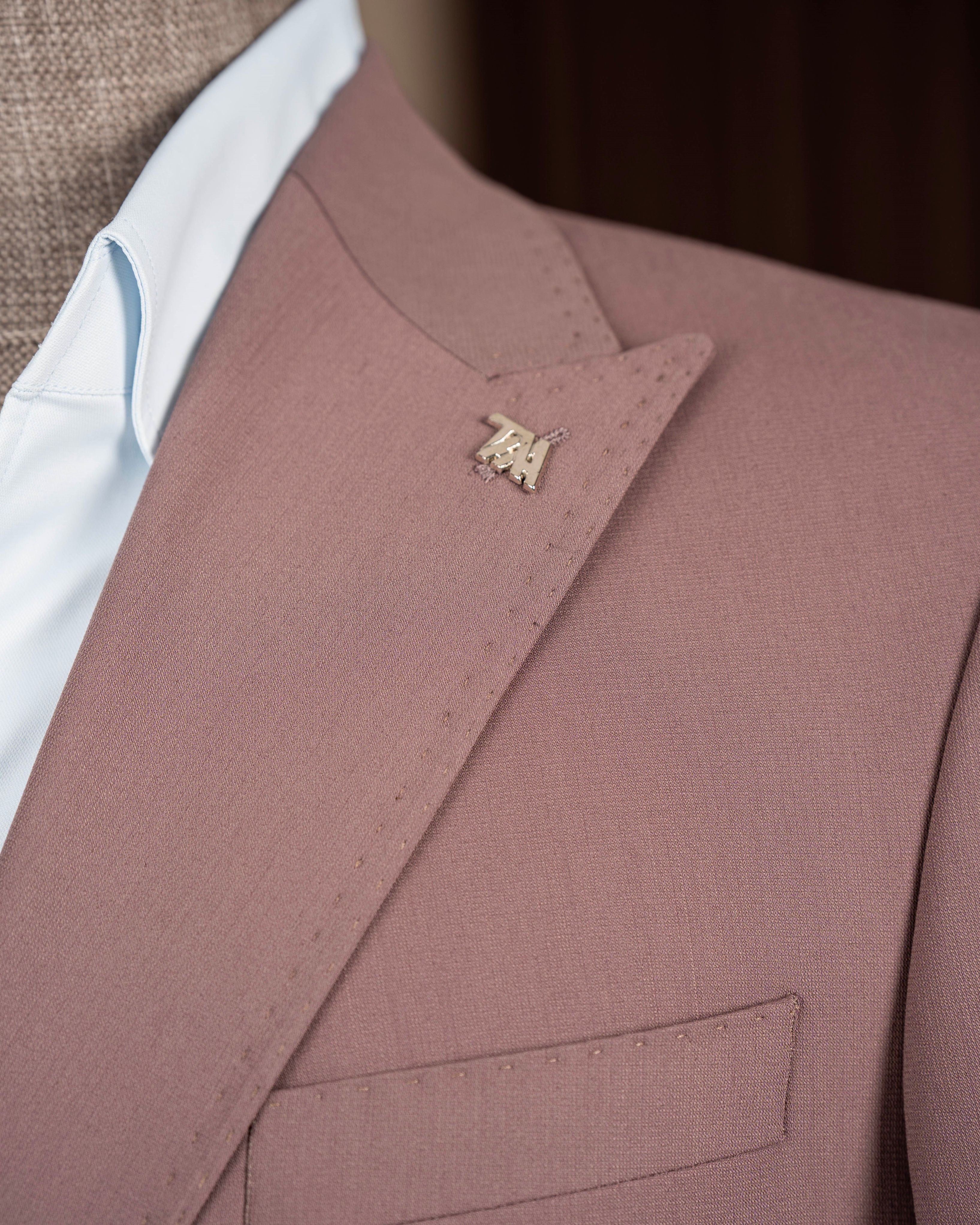 Dusty pink double-breasted suit – two-piece displaying jacket silhouette, side angle
