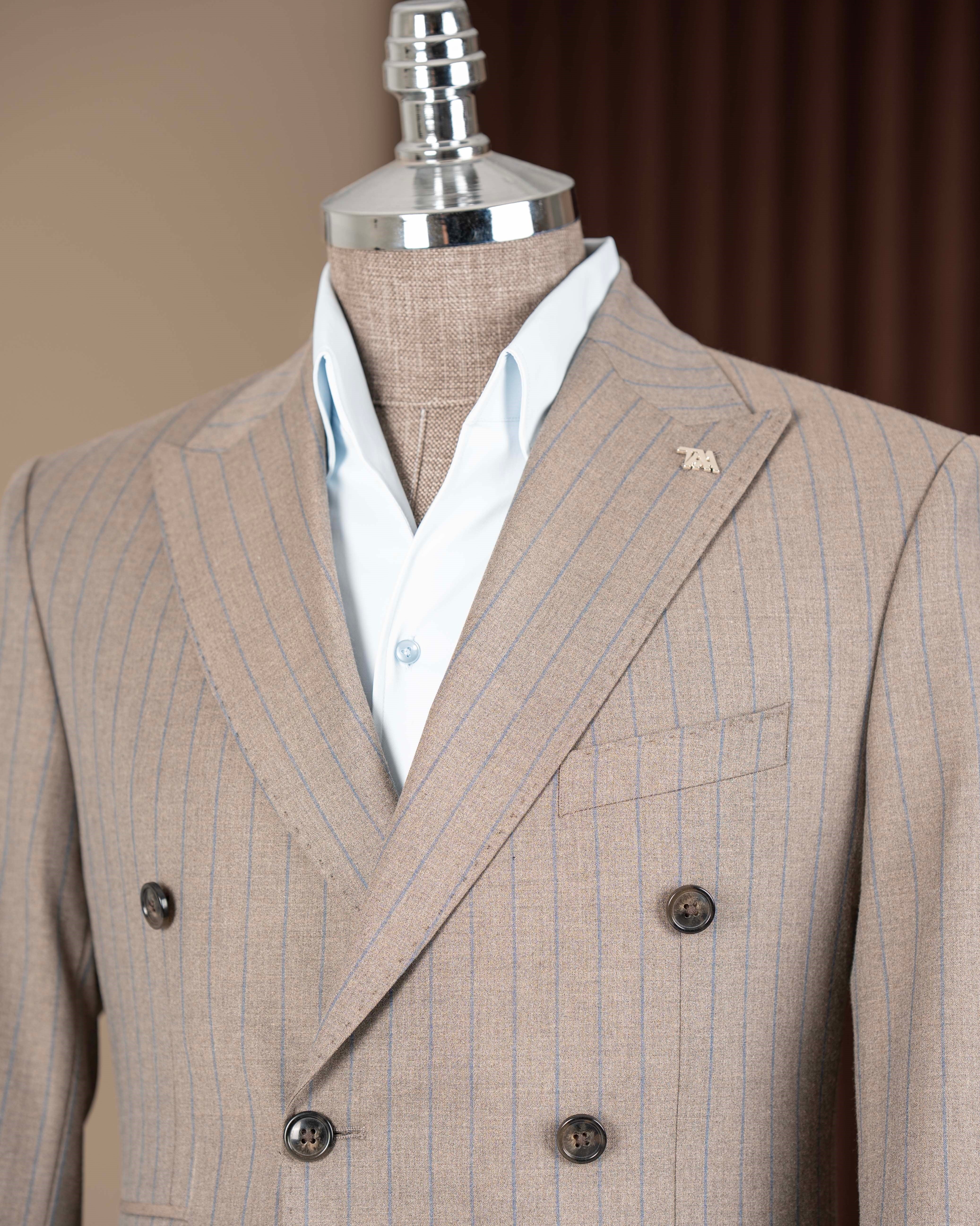 Beige striped double-breasted suit – back view displaying center vent and jacket silhouette