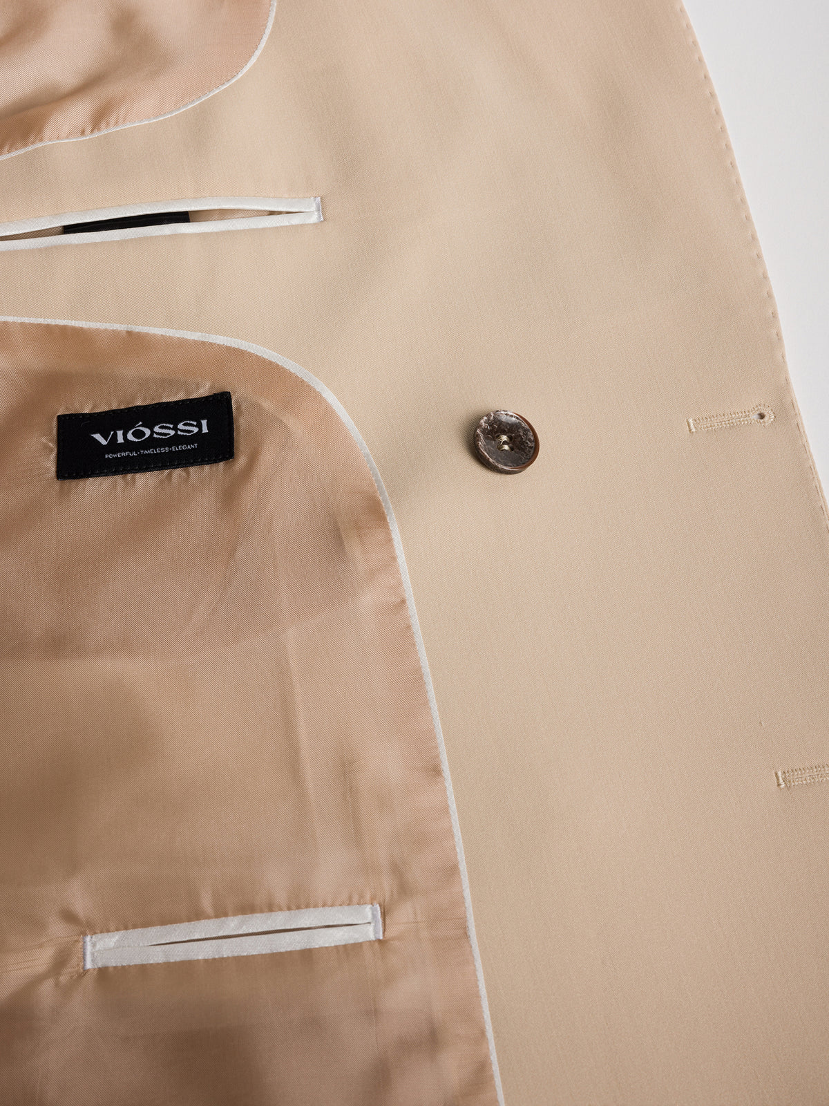 VIOSSI London Beige double breasted blazer three-quarter angle showing classic tuxedo double breasted styling