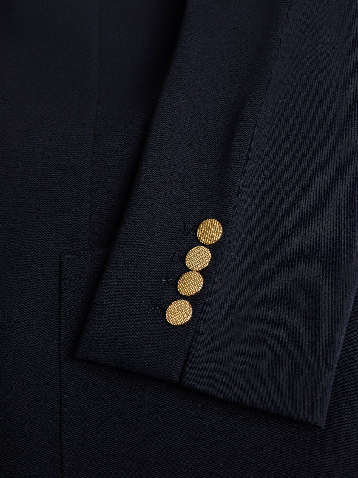 VIOSSI London Navy men double breasted blazer detail view of peaked lapels and gold button hardware