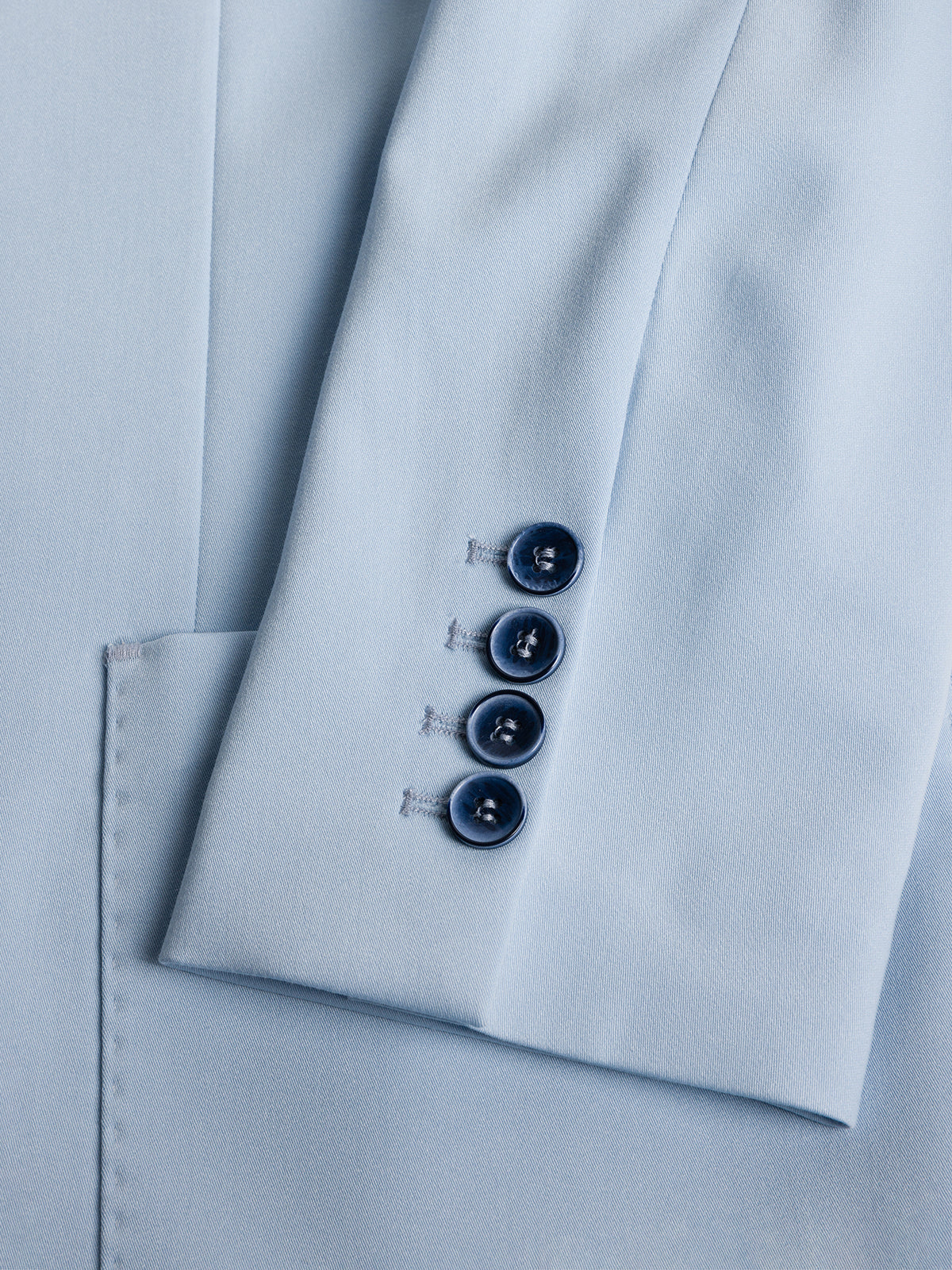 VIOSSI London Sky-Blue Double Breasted Blazer detail shot - light blue wedding suit showing fabric texture and buttons