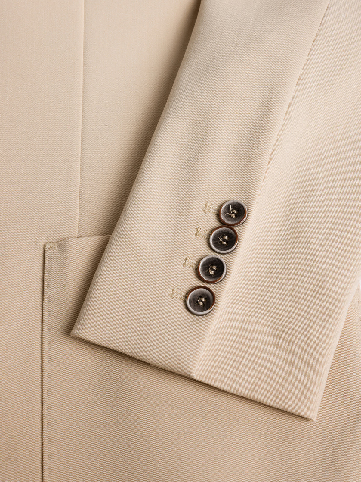 VIOSSI London Beige double breasted blazer lifestyle shot with model in formal business attire