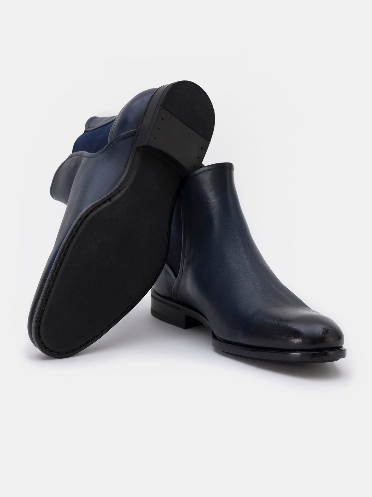 VIOSSI navy leather boots detail shot of stitching and texture, luxurious navy boots leather craftsmanship