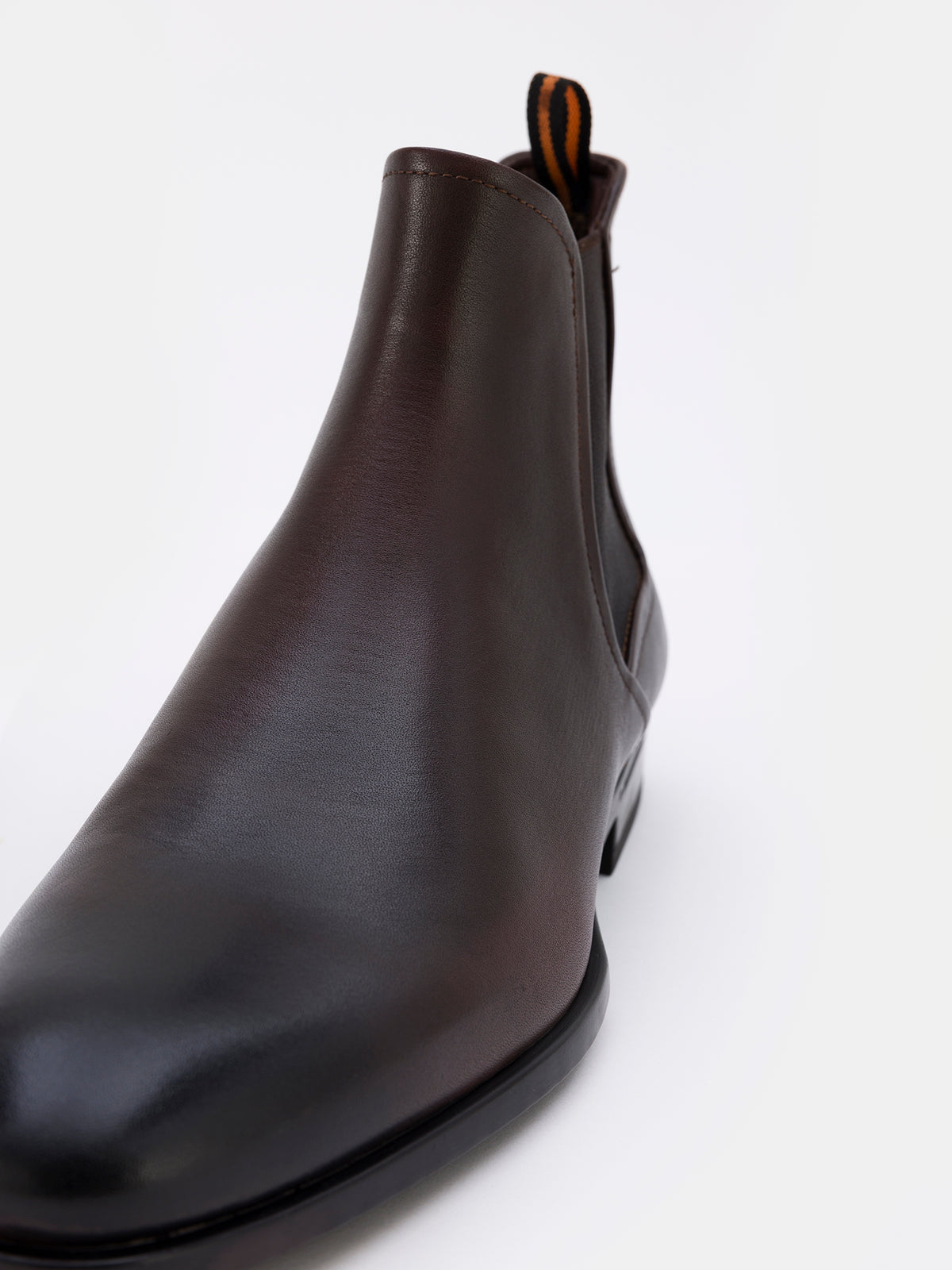 VIOSSI brown leather Chelsea boots styled with brown suit, showcasing versatile dress boot design
