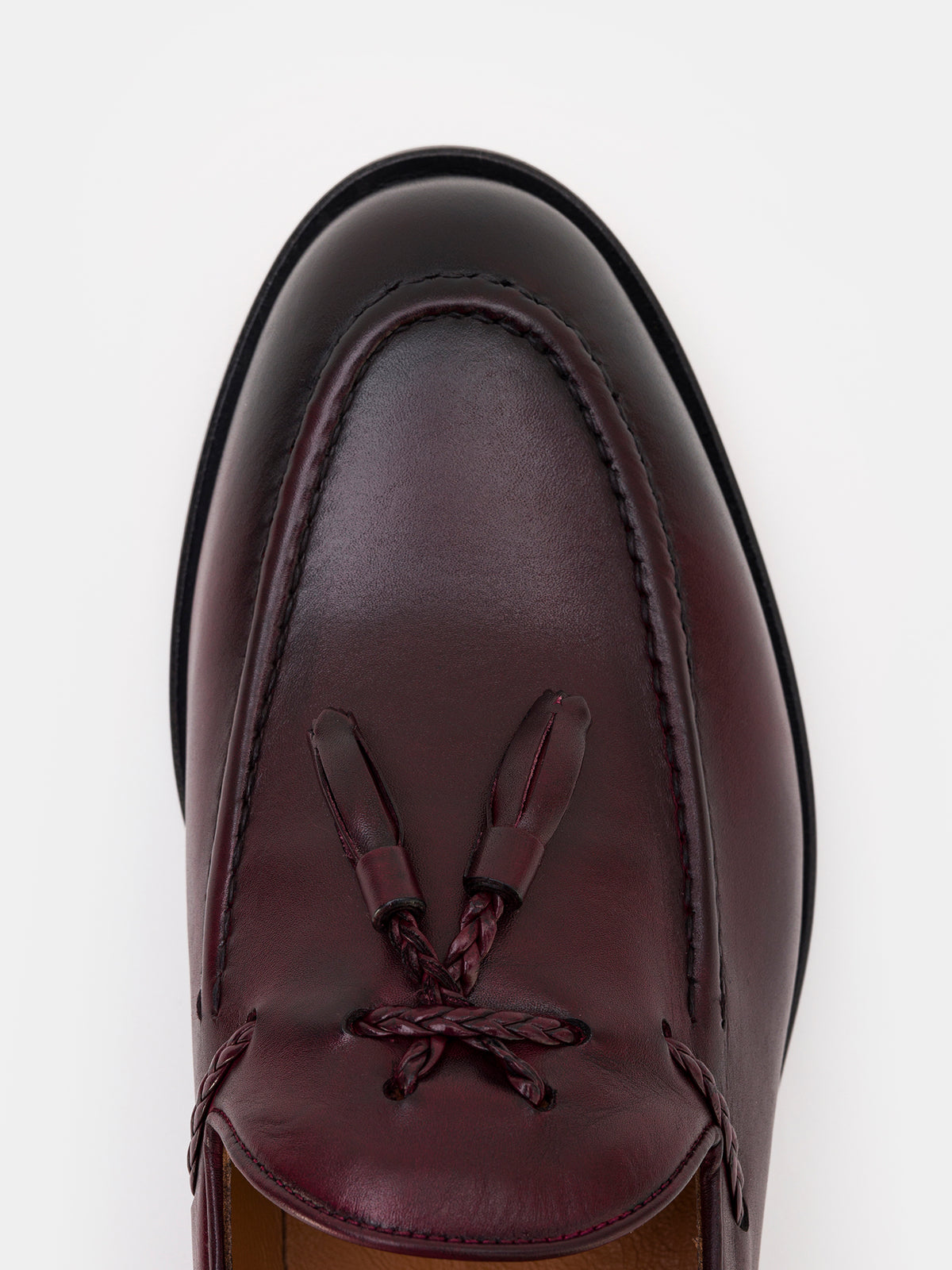 VIOSSI bordeaux loafers lifestyle shot demonstrating elegant formal footwear in professional setting