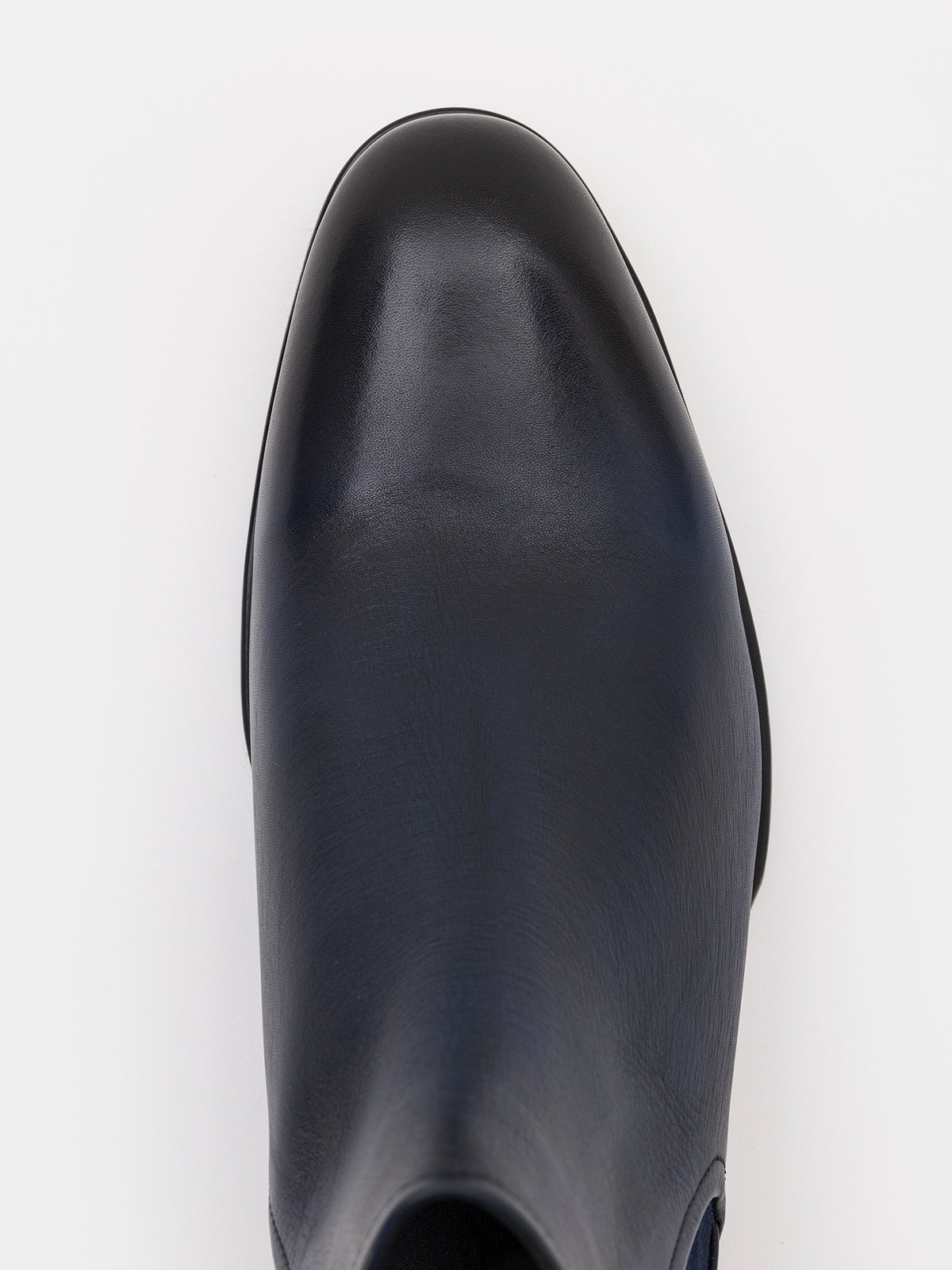 VIOSSI navy leather boots - detailed close-up of navy Chelsea boots showing leather texture and craftsmanship