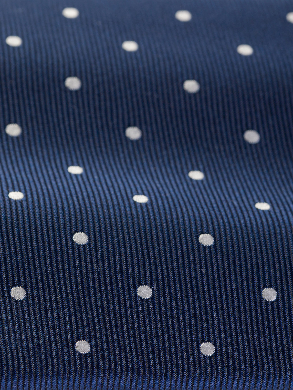 VIOSSI navy tie with polka dots back view showing fabric texture and construction details
