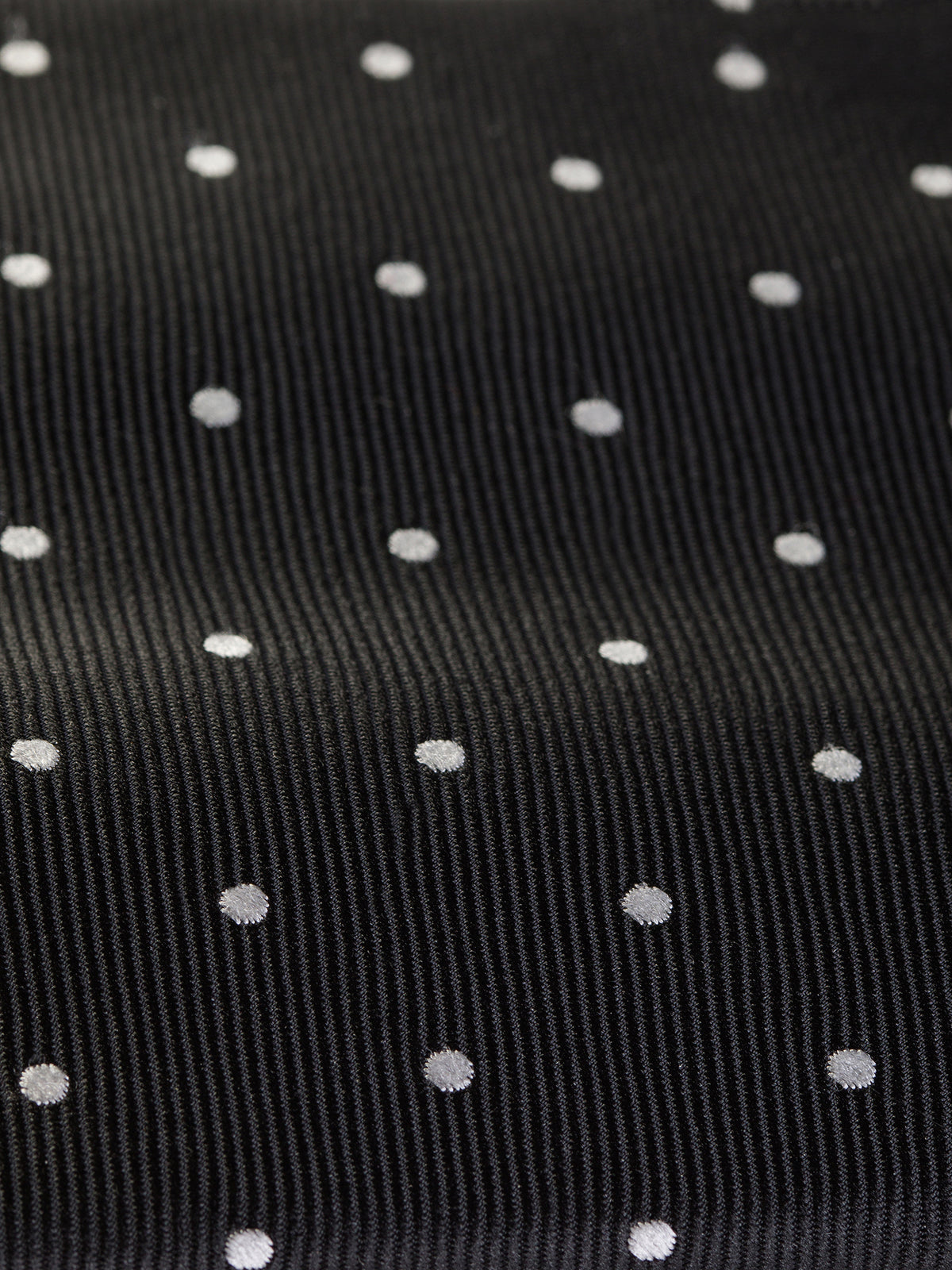 VIOSSI black polka-dot tie back construction view, ideal complement to black tuxedo ensembles