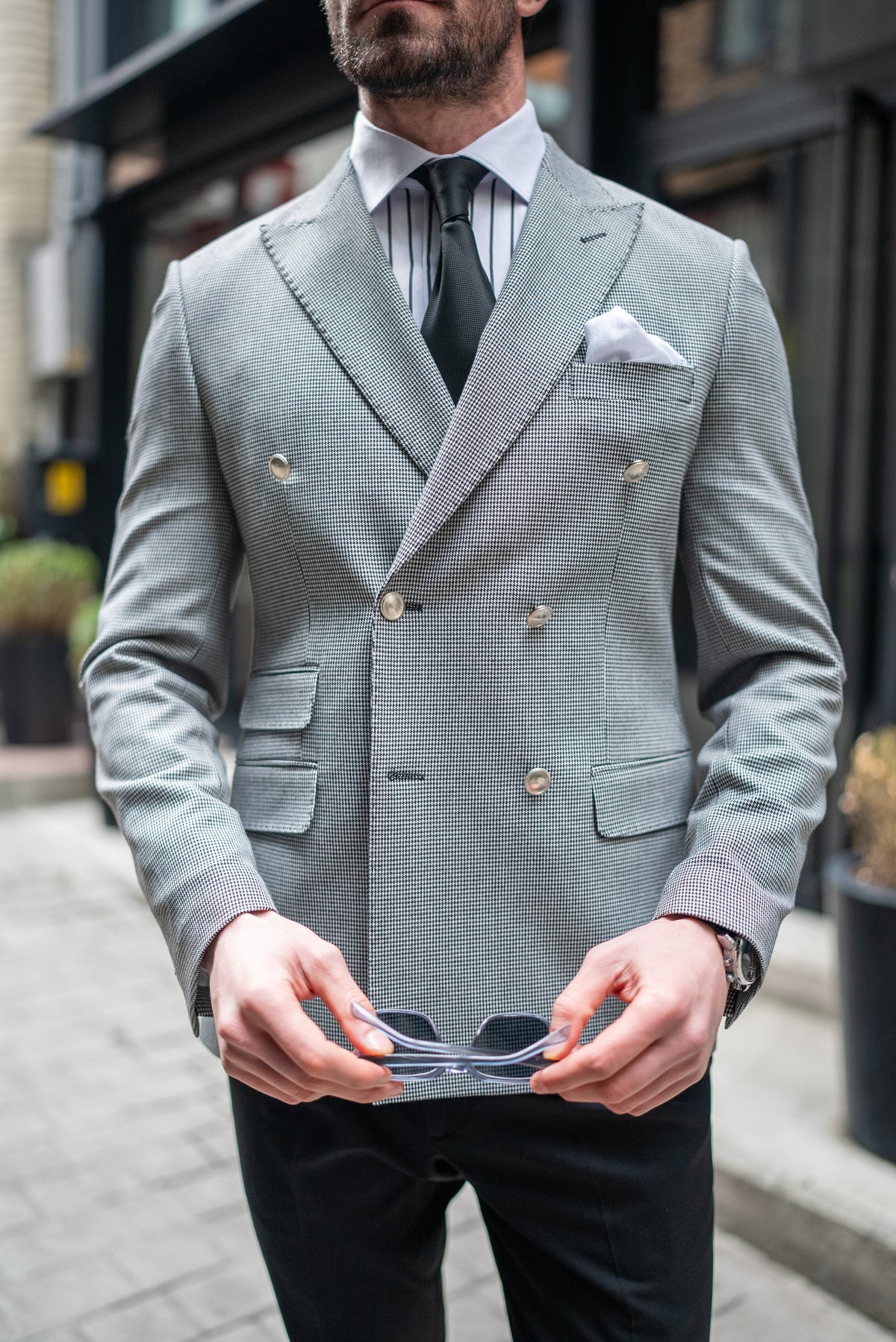 VIOSSI white houndstooth men double breasted blazer detail shot highlighting button closure and lapels