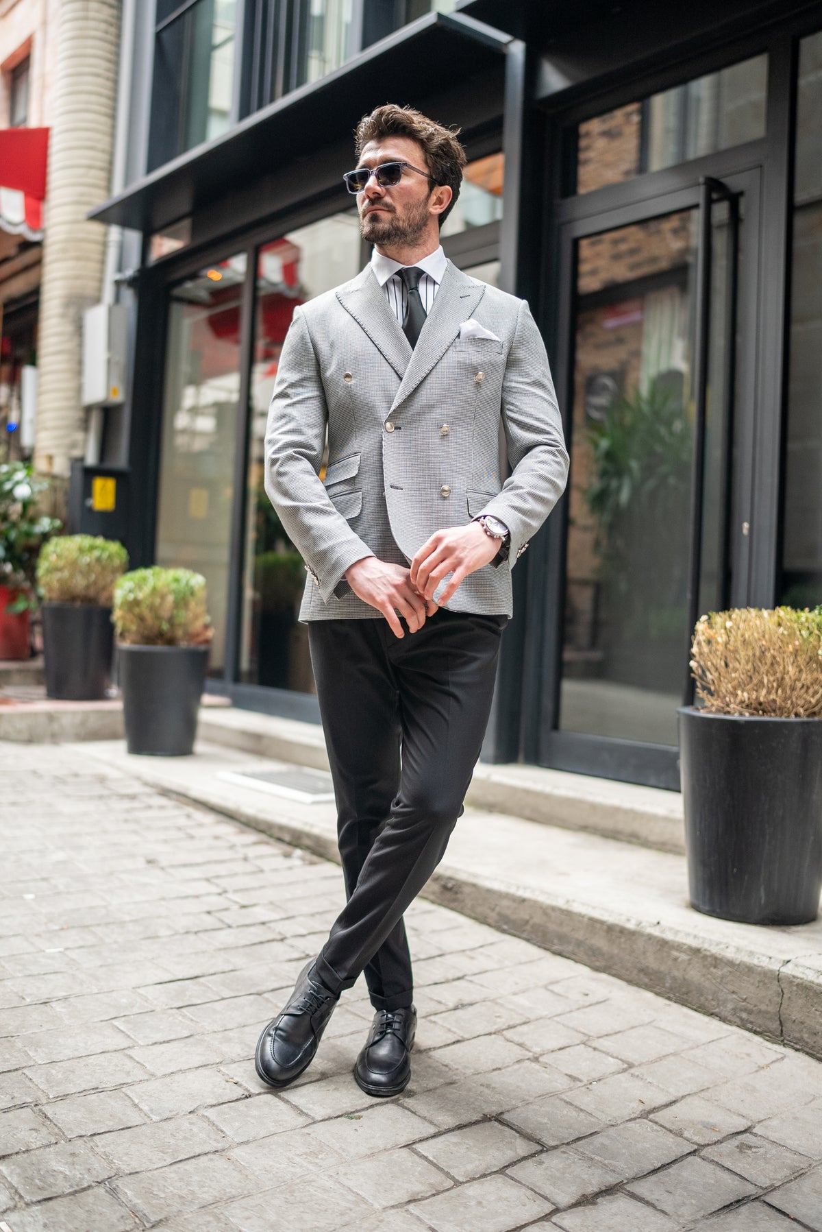 VIOSSI white houndstooth double breasted blazer lifestyle shot showing versatile formal wear styling