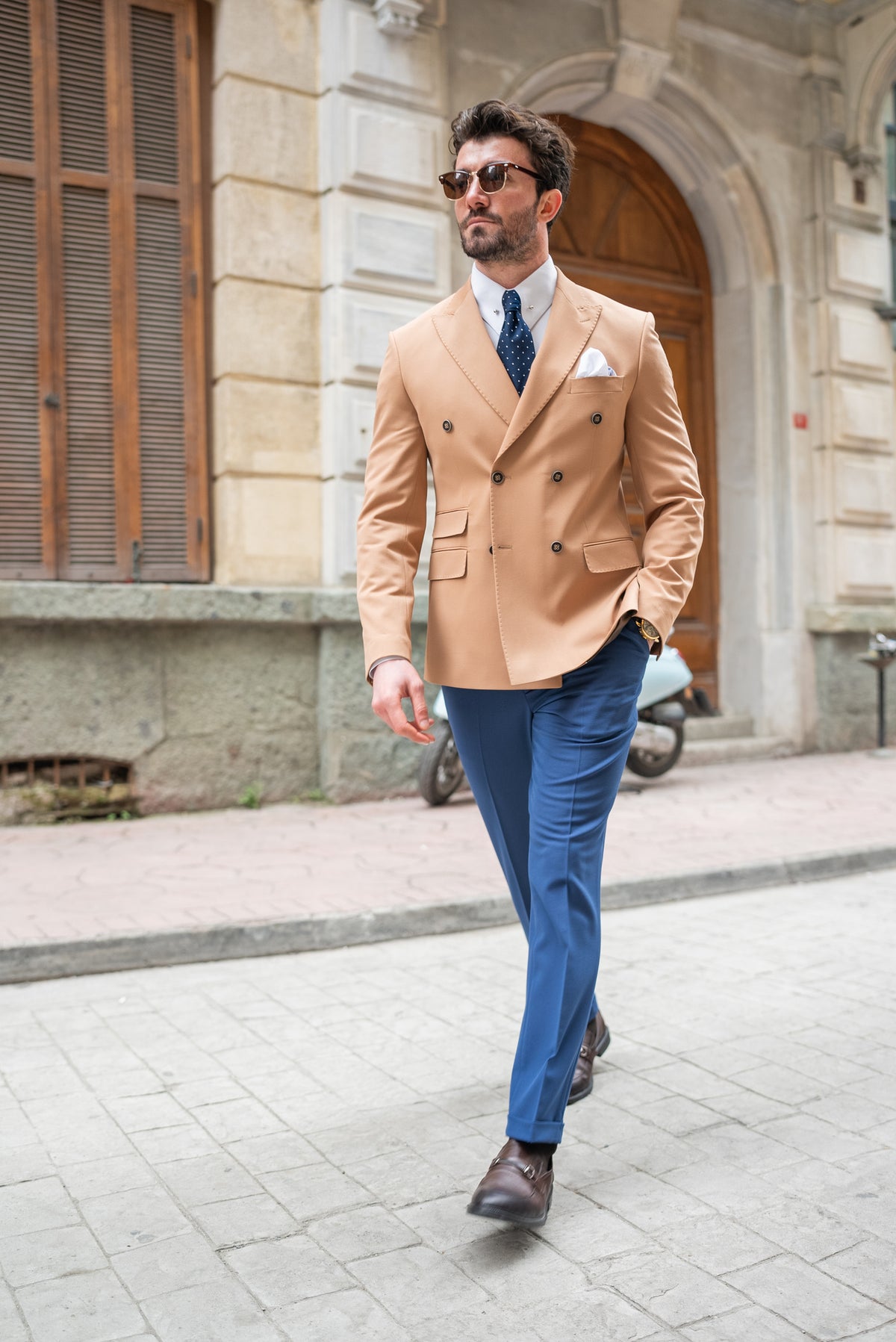 VIOSSI camel double breasted blazer cuff and sleeve detail showing tailored finishing