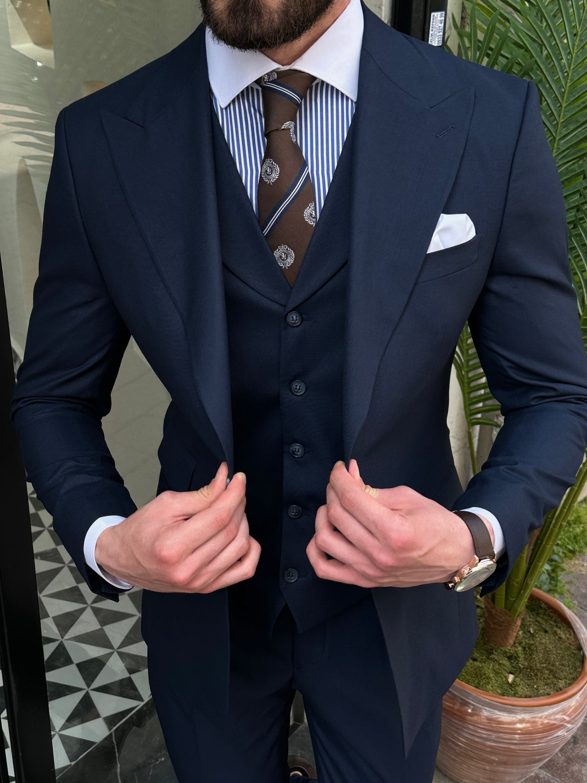 VIOSSI navy slim-fit 3-piece suit side profile showing structured silhouette - Italian suit styles with modern cut