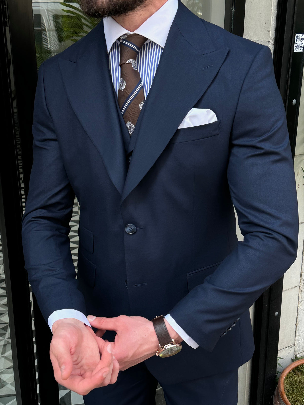 VIOSSI navy slim-fit 3-piece suit jacket detail view - Italian suit styles featuring quality construction and finish