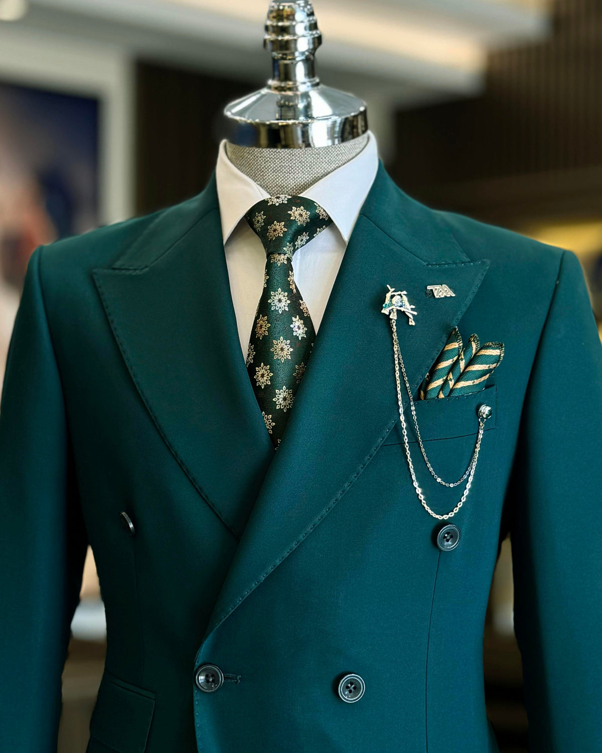 VIOSSI green tuxedo double breasted 2-piece suit shown from front view with peak lapels and structured tailoring