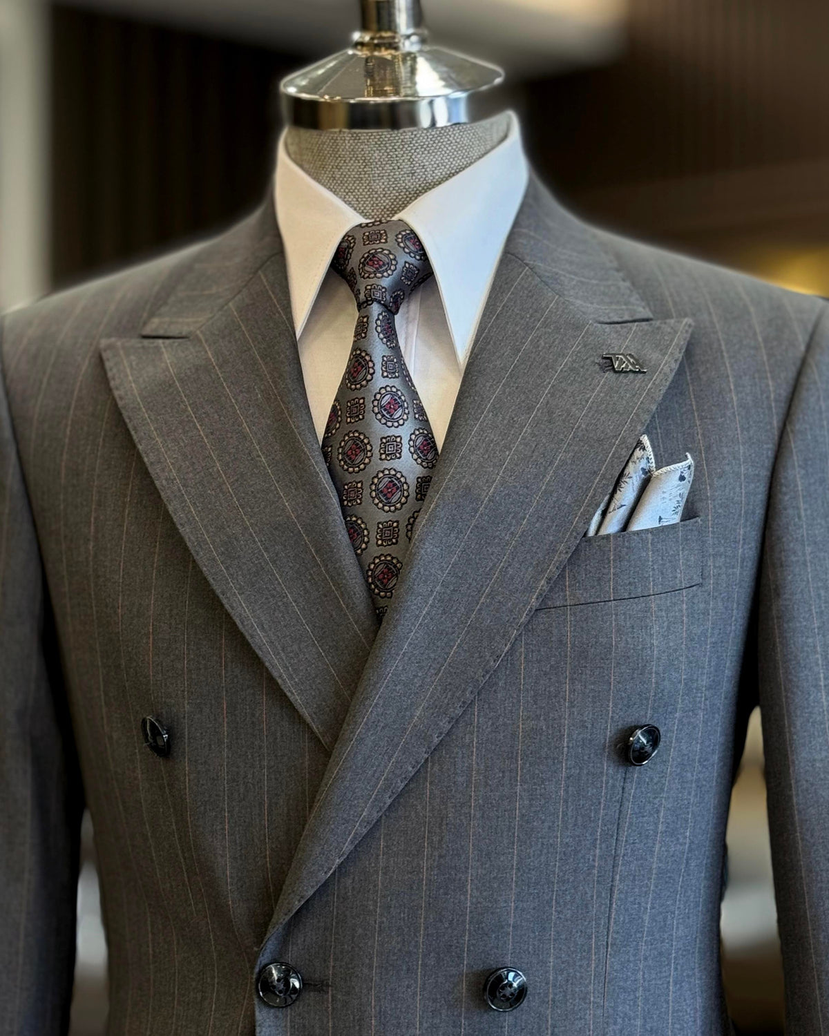 VIOSSI grey striped double breasted suit styled detail shot showcasing Italian suit styles elements