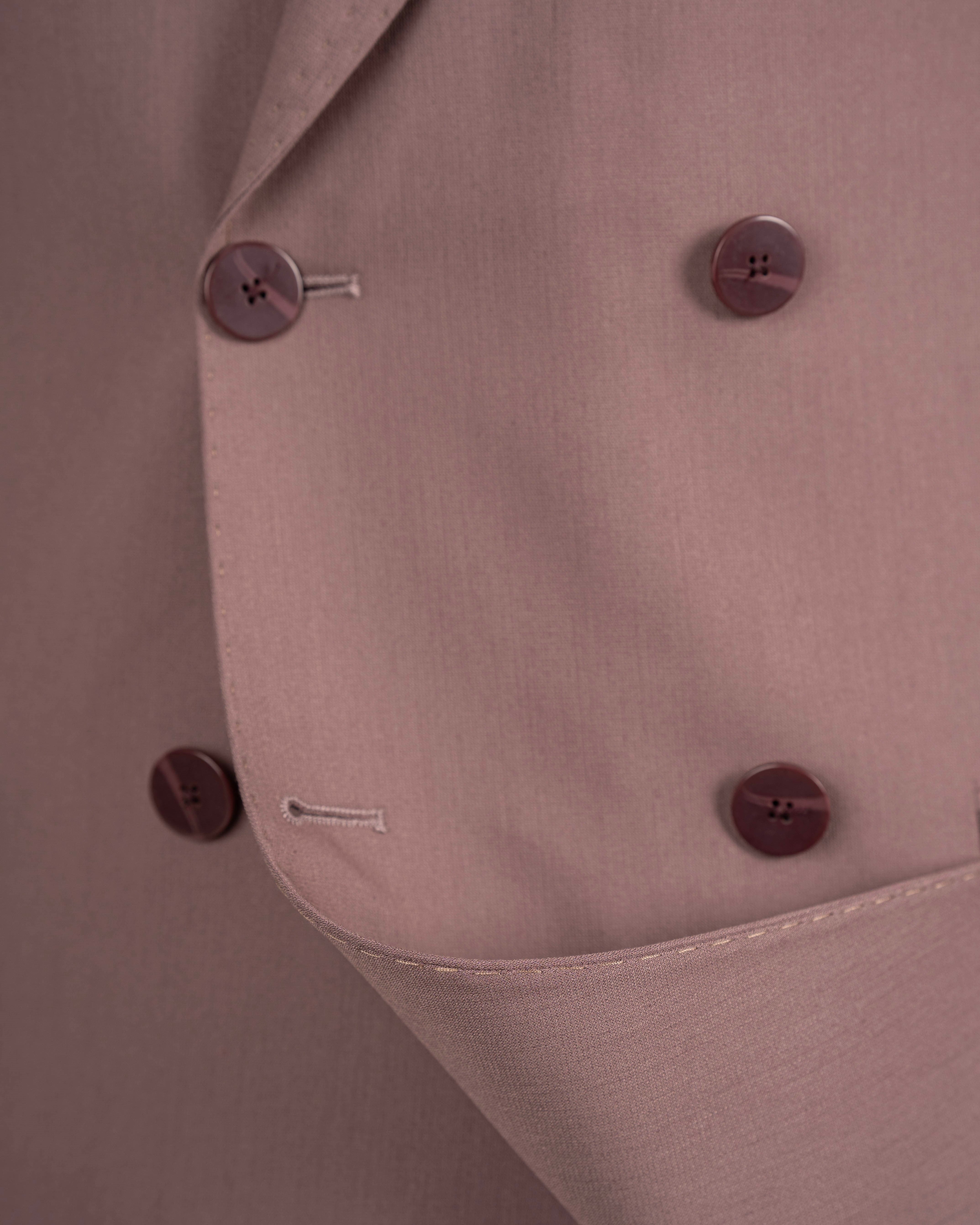 Dusty pink double-breasted suit – close-up of button detail and lapel construction