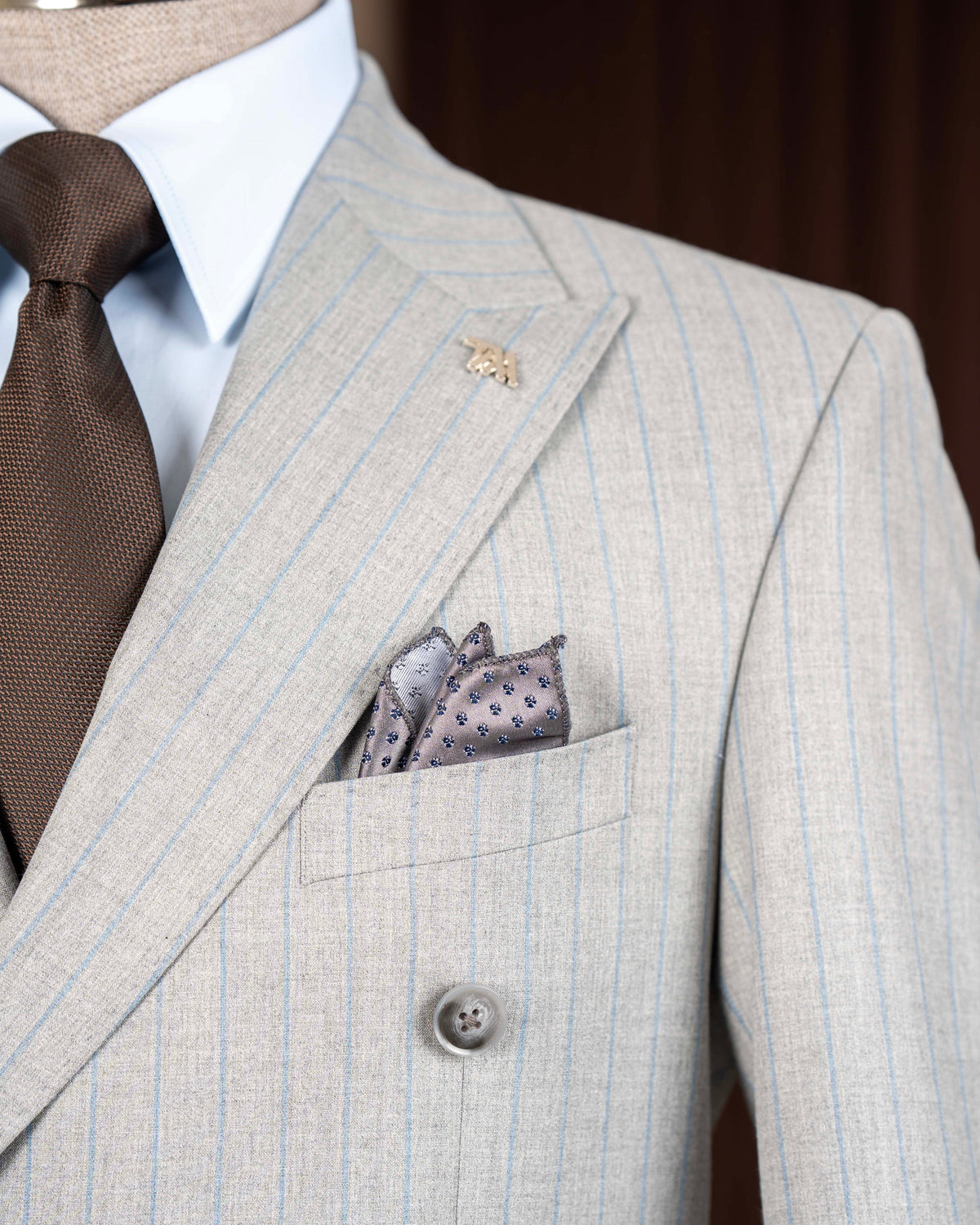 Grey striped double-breasted suit – close-up detail of fabric stripes and buttons