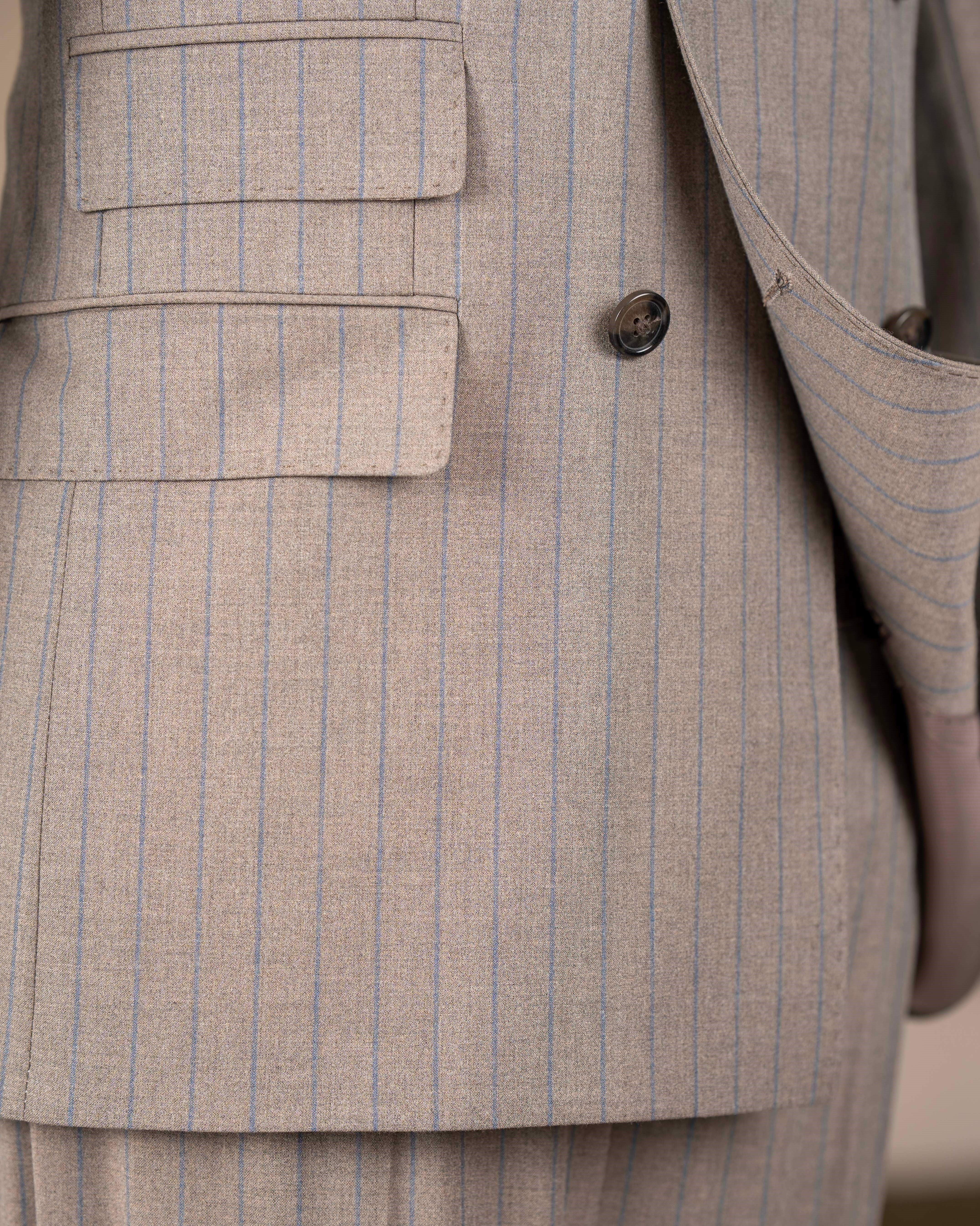 Beige striped double-breasted suit – close-up detail of buttons and striped fabric texture