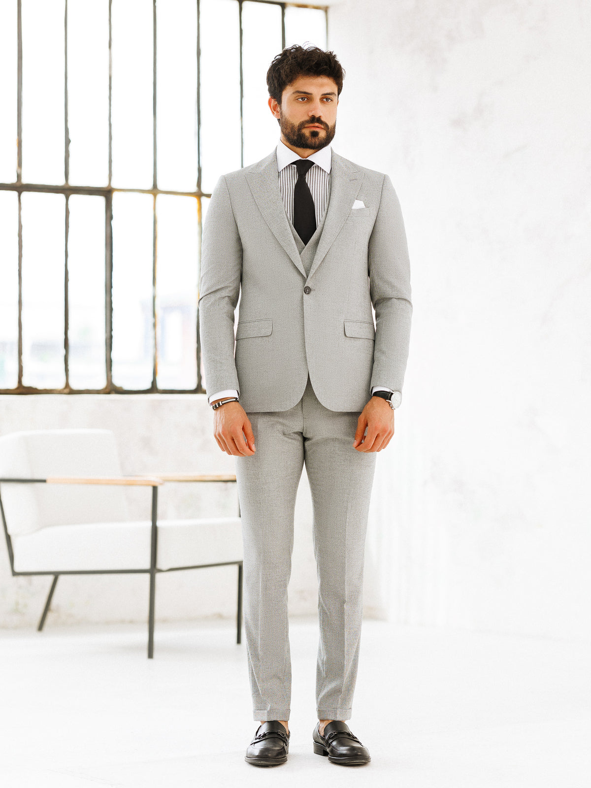 VIOSSI light grey slim-fit 3-piece suit jacket detail view highlighting Italian suit styles construction
