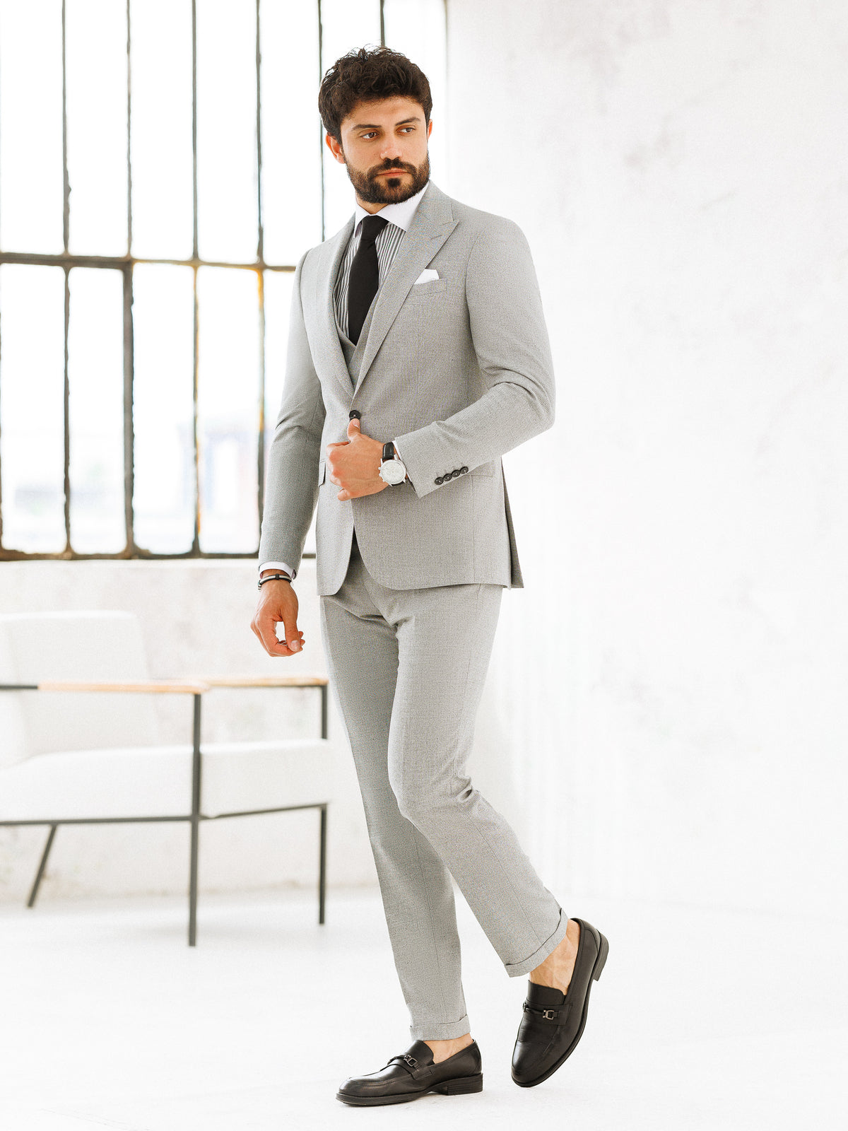VIOSSI light grey slim-fit 3-piece suit trouser detail featuring Italian suit styles finishing touches