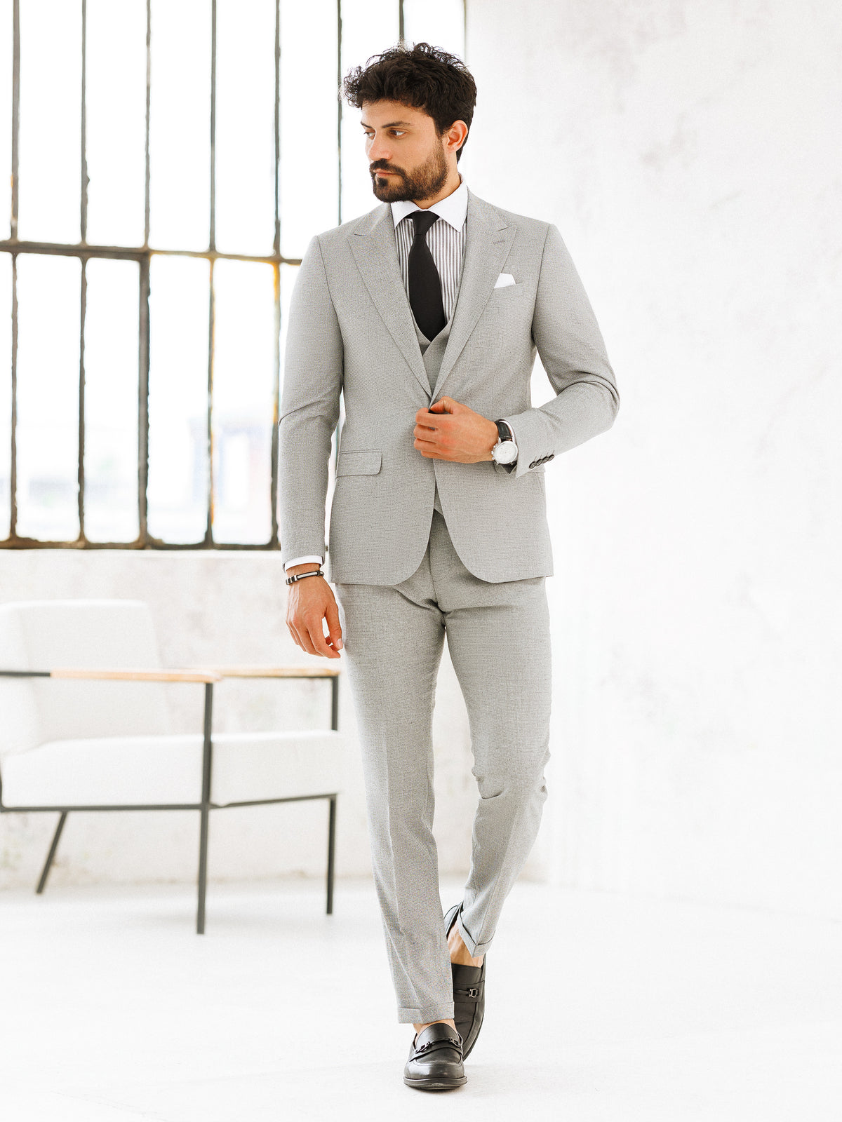 VIOSSI light grey slim-fit 3-piece suit styled on model - Italian suit styles for formal occasions