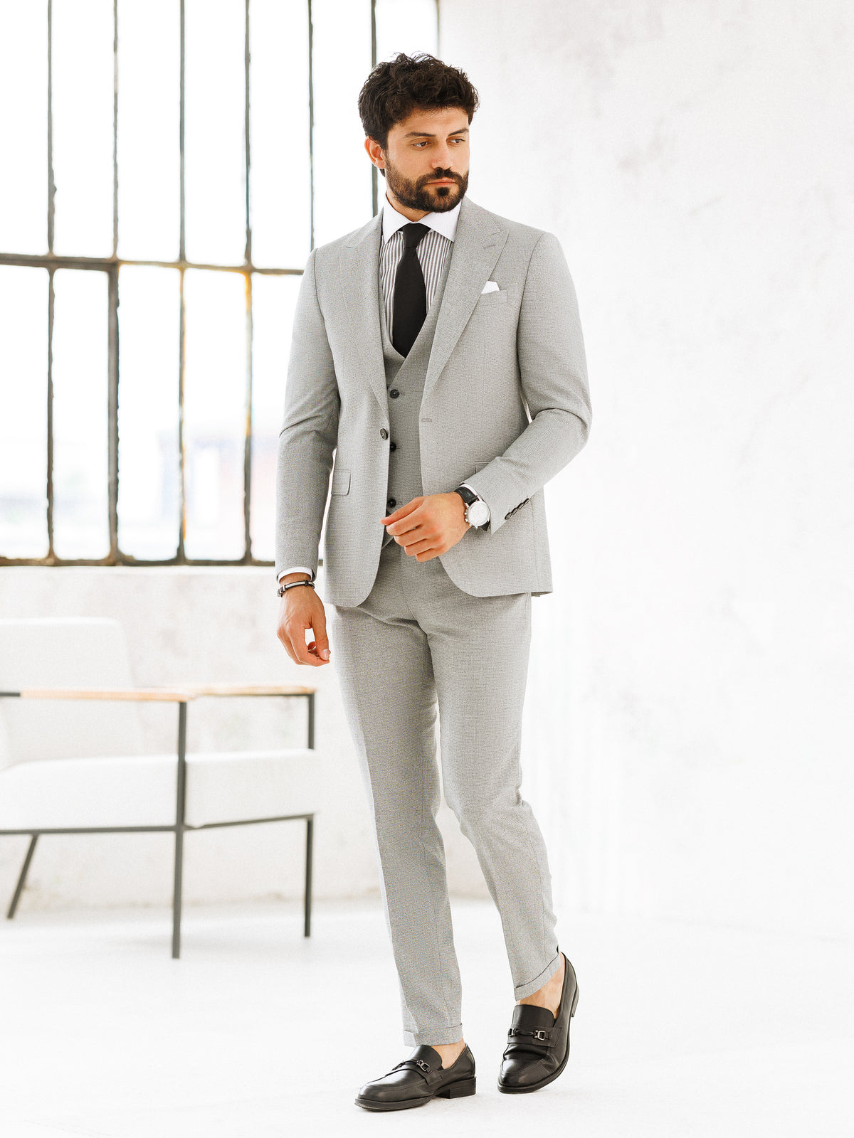 VIOSSI light grey slim-fit 3-piece suit side angle displaying structured silhouette and Italian suit styles